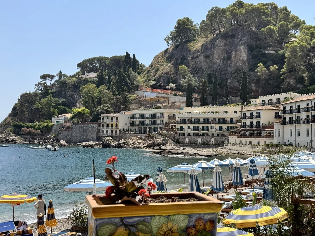 Sicily coast, blue sea and yellow parasols