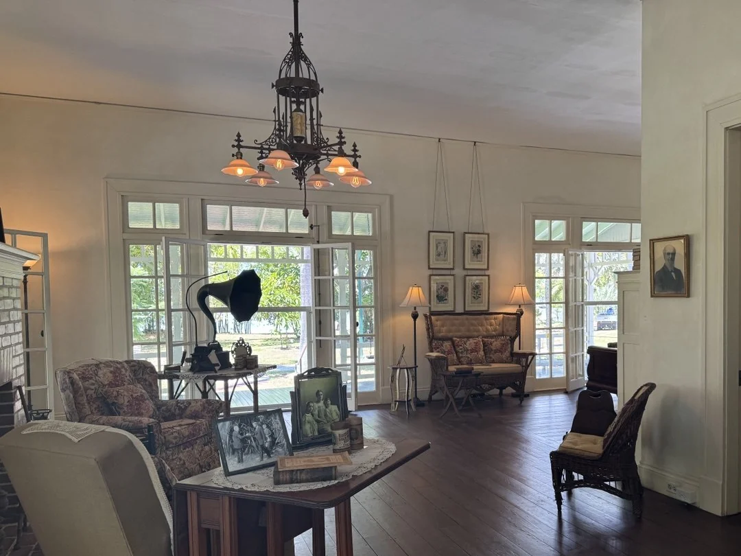 Historic interior with wicker seating, dark timber and warm lamps